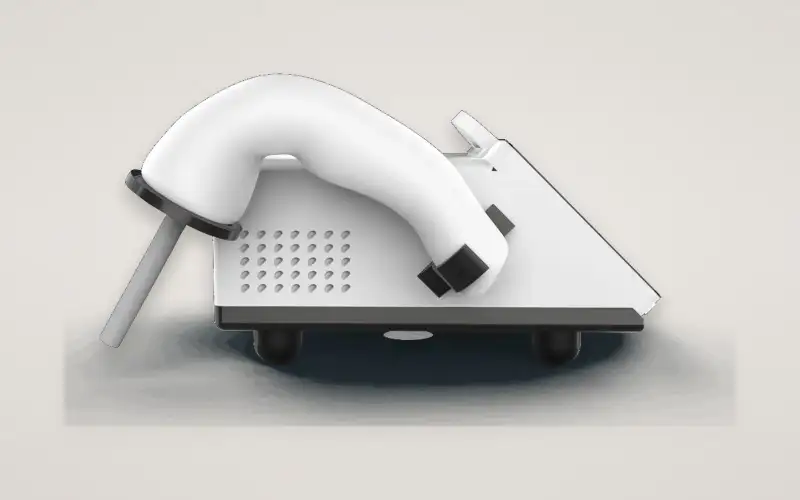 EKKO Clinic V1 from the side, showing a docked wand, its probe and the speaker grille.