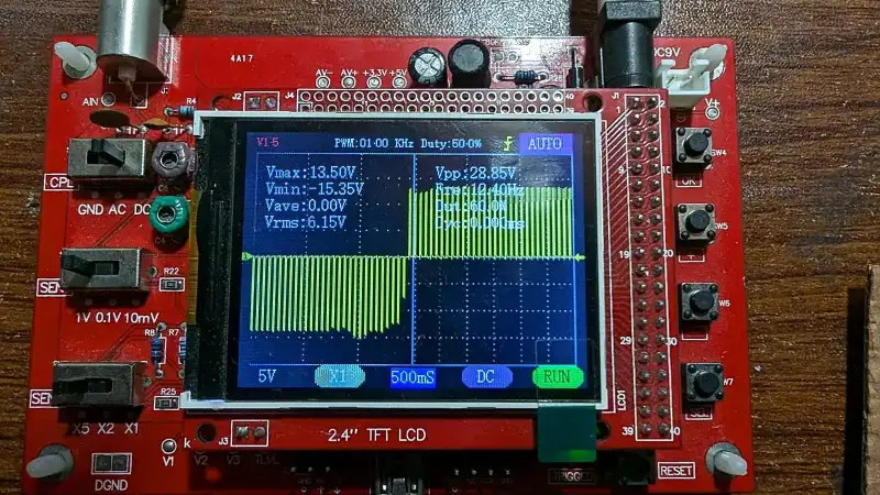 Oscilloscope screen showing the stimulator’s biphasic output.