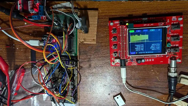 Bench testing with the oscilloscope and prototype circuits.