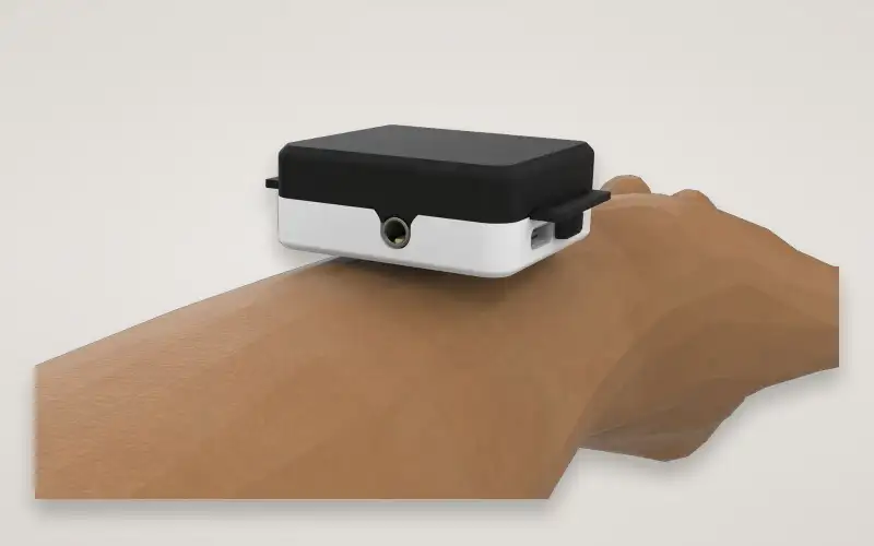 Render of the EPIC wearable on the back of a wrist, seen from the side.