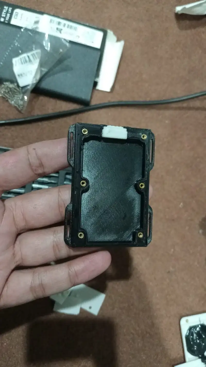 The printed enclosure held in a hand.