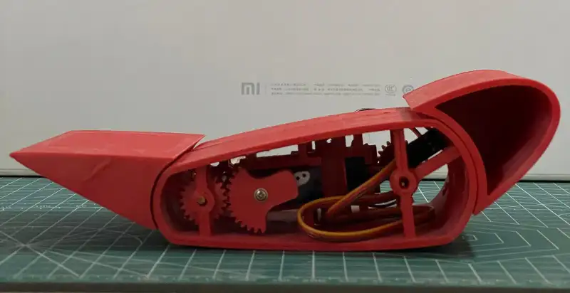The printed airfoil, assembled, with its servo mechanism exposed.