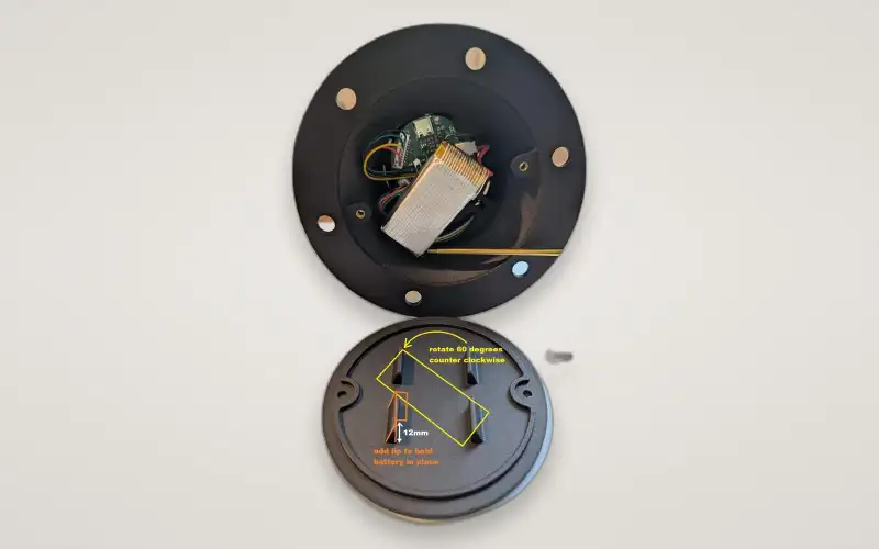The beacon opened in two halves, showing the battery and boards, with notes on adding a lip to hold the battery.
