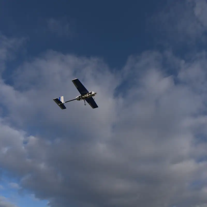Render of the UAV against a cloudy sky.